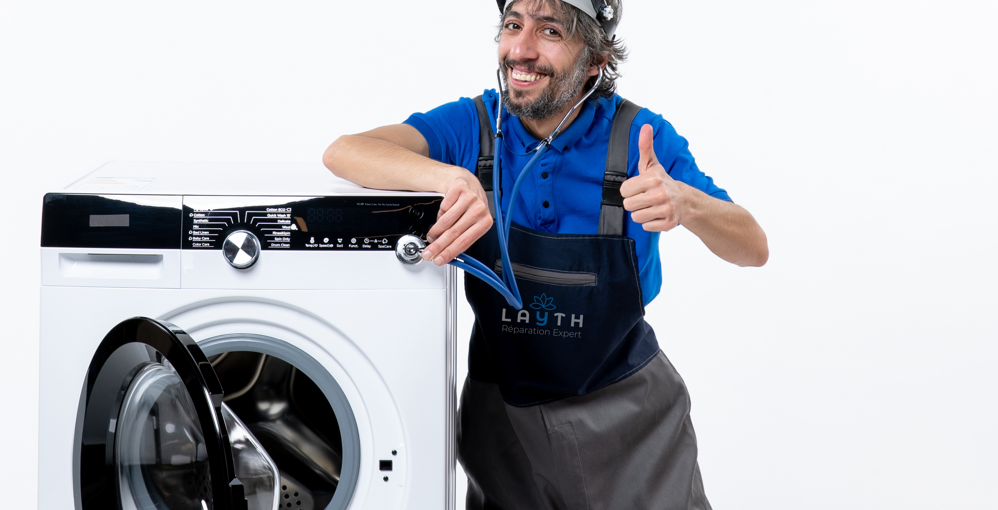 front-view-happy-repairman-sitting-near-washing-machine-making-thumb-up-sign-white-space